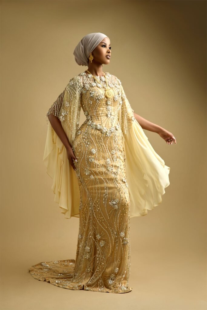 Gold hand-beaded reception gown with cape