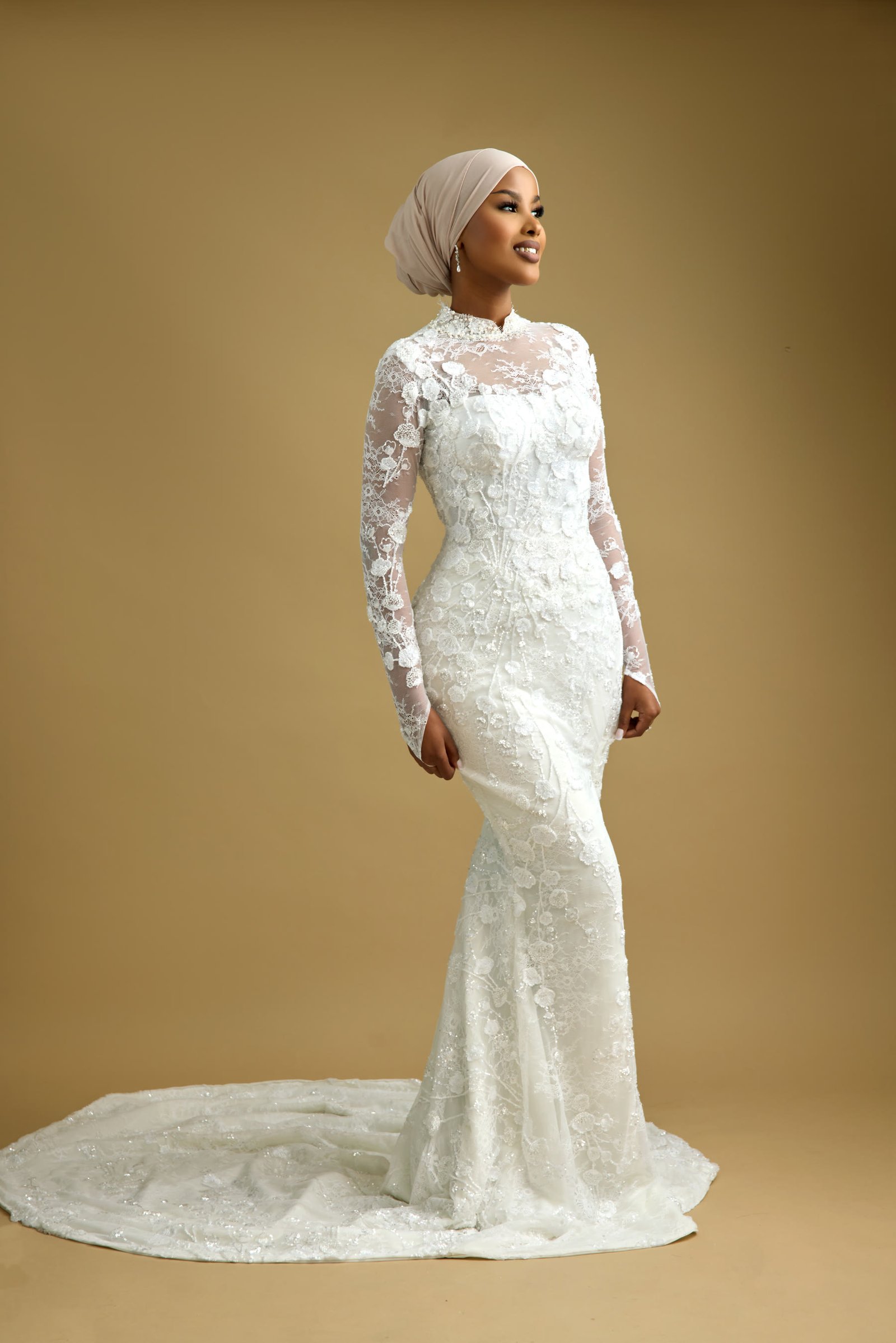 High illusion neckline closing the front of a lace bridal bodice