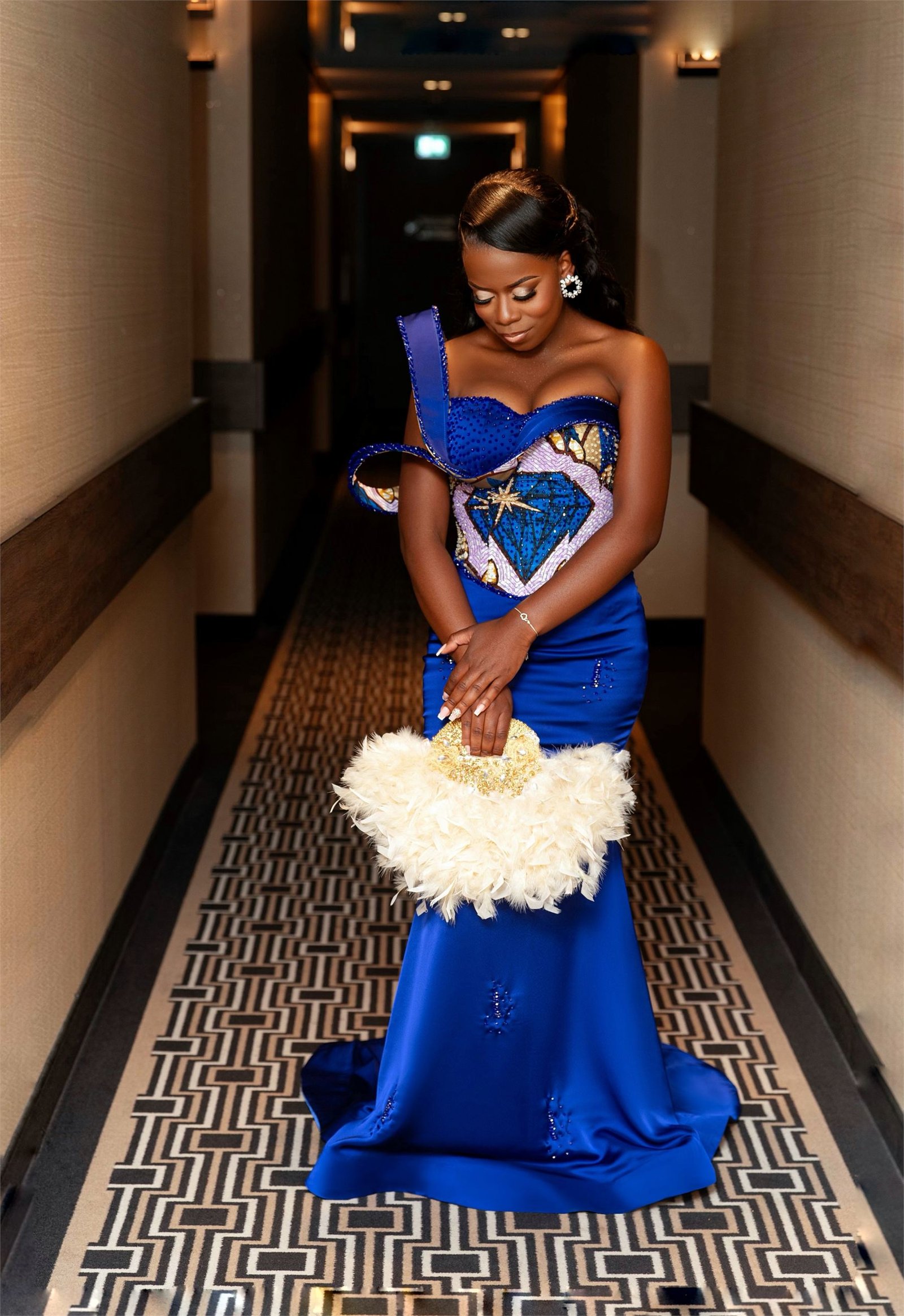 Cobalt traditional couture gown with structured heritage-print bodice